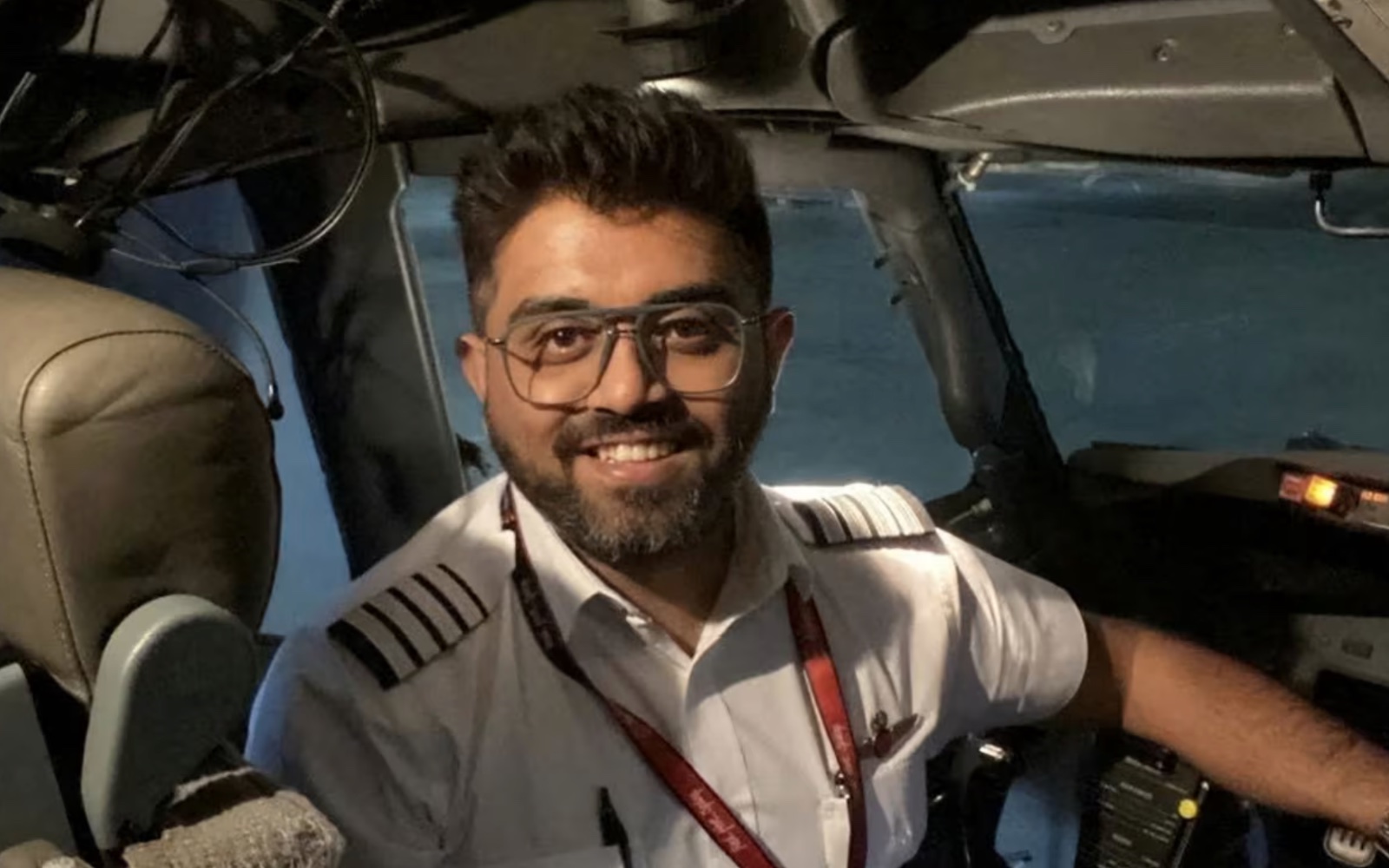 Captain Smit Machchhar in uniform in the cockpit of a Boeing 737